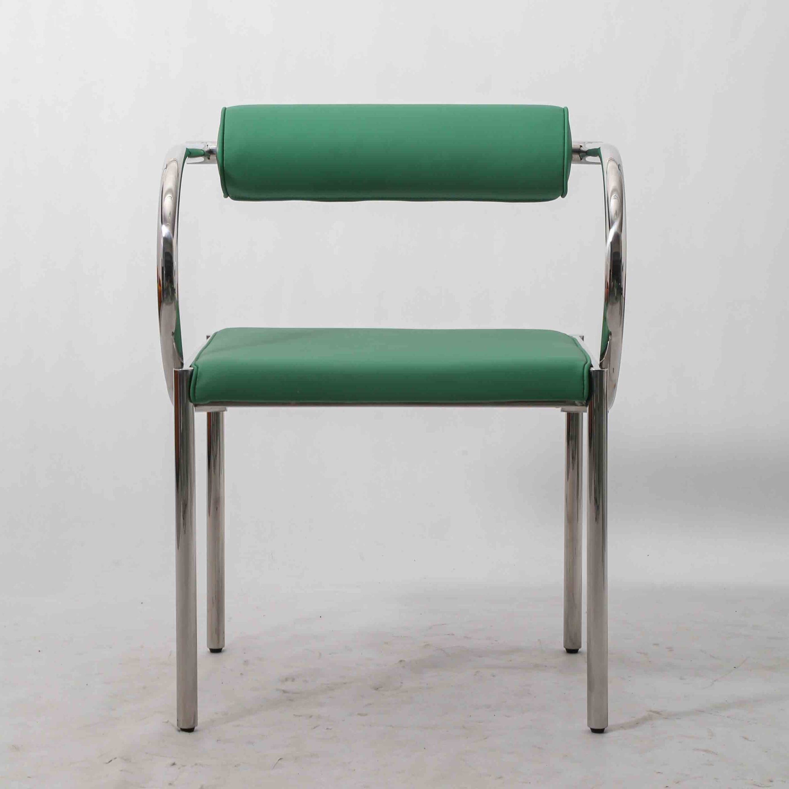 Front view of postmodern Italian PU leather armchair featuring sleek stainless steel structure.