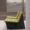 Single-seat yellow woven chair with minimalist birch wood legs