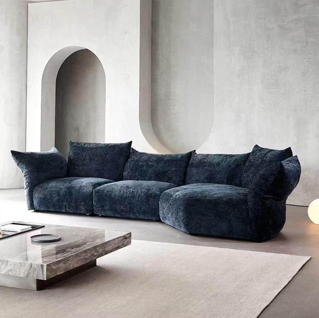Modern minimalist living room with a petal-shaped chenille sofa featuring adjustable lumbar support.