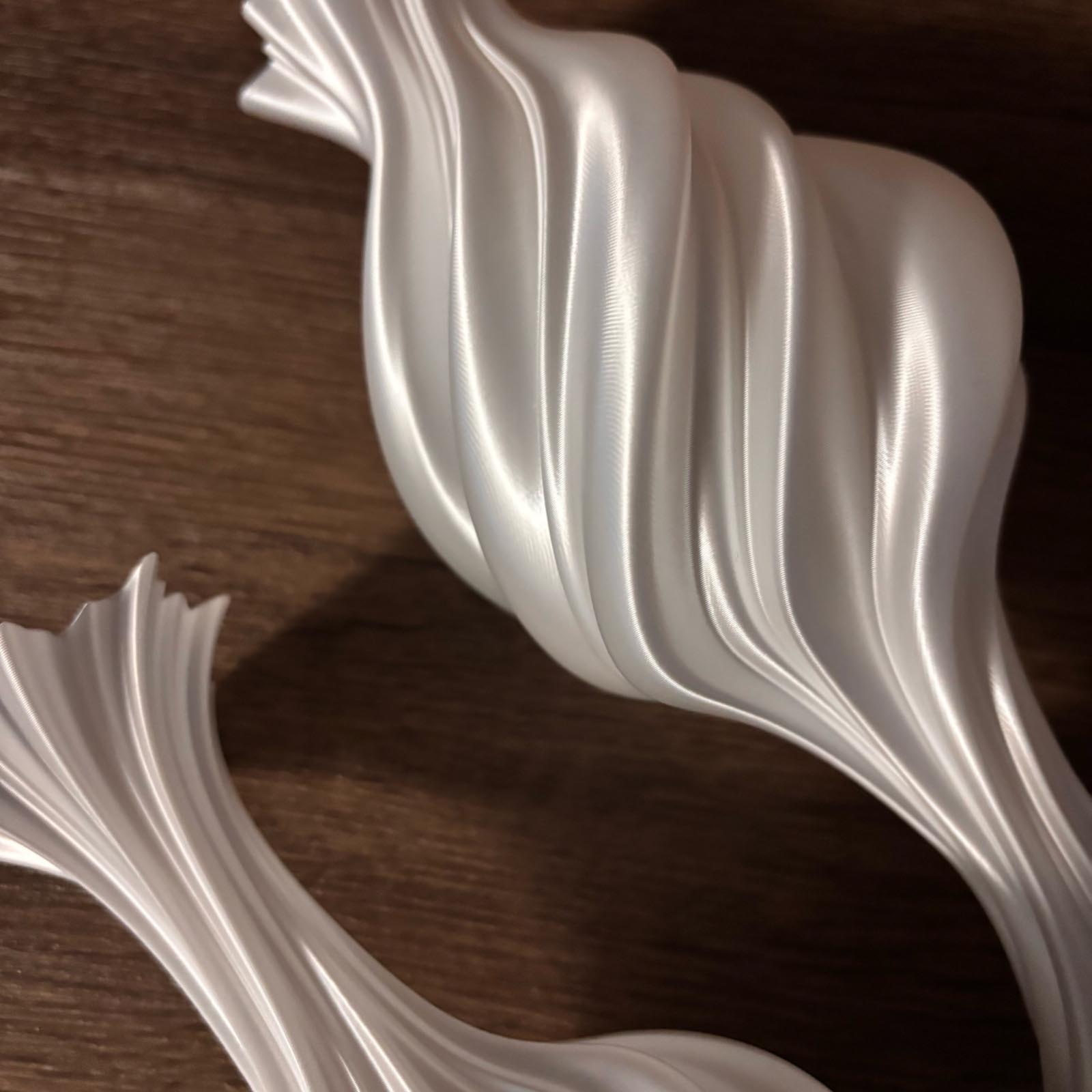 3D printed sculptural white vase on wooden background