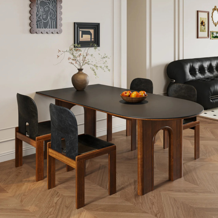 Detail of classic dining table leg in arched silhouette and white ash finish with solid travertine stone inset