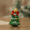 Mini resin Christmas tree figurine with golden star topper, red gift boxes, and 10cm height – tabletop decoration.