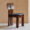 Modern ash wood dining chair with sculptural backrest and faux leather seat