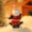 Santa Claus resin figurine sitting cross-legged with guitar – whimsical Christmas decoration.