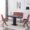 Modern red fabric dining set with chairs, bench, and black rectangular table in contemporary restaurant interior.