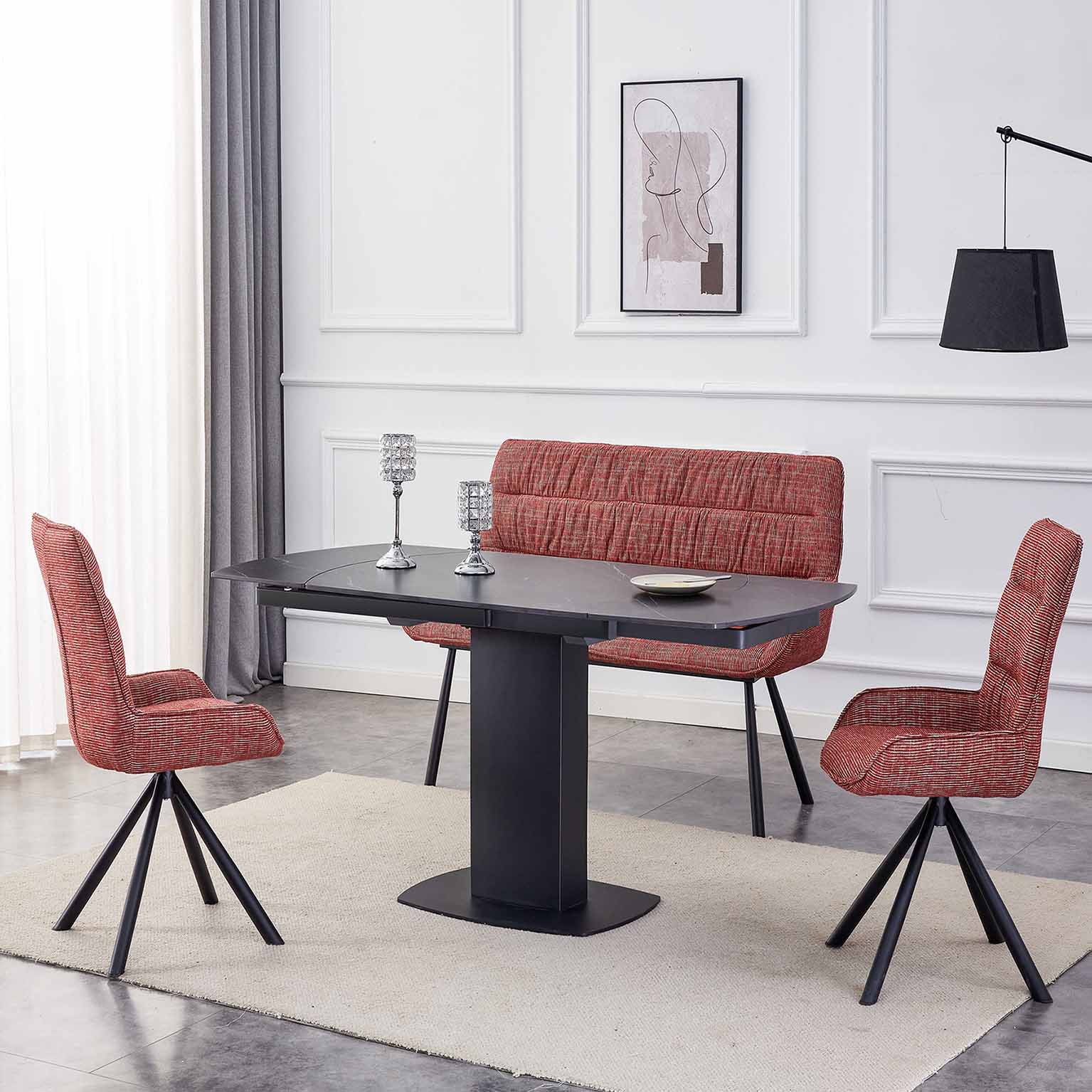 Modern red fabric dining set with chairs, bench, and black rectangular table in contemporary restaurant interior.